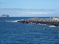 North Seymour Island in the Galapagos about to land on shore, Daphne Island is in the distance.