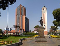 Clock tower of the University Park (foreground) and the Javier Alzamora Valdez Building (background)