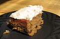 A carrot cake with white icing