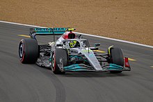 Lewis Hamilton salutes the Silverstone crowd at Luffield after coming in third place at the 2022 British Grand Prix (52208974287).jpg