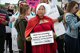 Dressed as a handmaiden StopTheBan rally participant.jpg