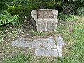 Historic District designation plaque on a piece of granite