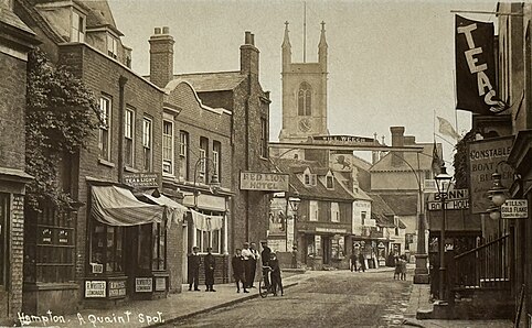 Hampton Thames Street c1911, showing the Red Lion hotel, the frontage to Constable's Boatyard and St Mary's Church. Note the unsurfaced road.