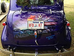 Painted mural on the trunk of a lowrider