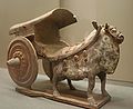 A Chinese Sui Dynasty (581–618 AD) cart figurine pulled by a bull