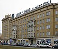 Deutsch: alte Leuchtreklame auf einem Mietshaus in Leipzig, 2009 - im typischen DDR-Stil. English: old neon sign at an apartment building in Leipzig, 2009, in the typical style of the German Democratic Republic