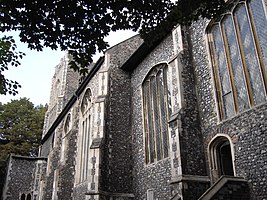 The decorative possibilities suggested by the contrast of limestone quoins against knapped flint no doubt inspired flushwork. (Church of St Peter Parmentergate, Norwich)