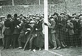 The crowd at the 1923 cup final spilling onto the pitch