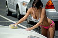 Washing the car in a string bikini