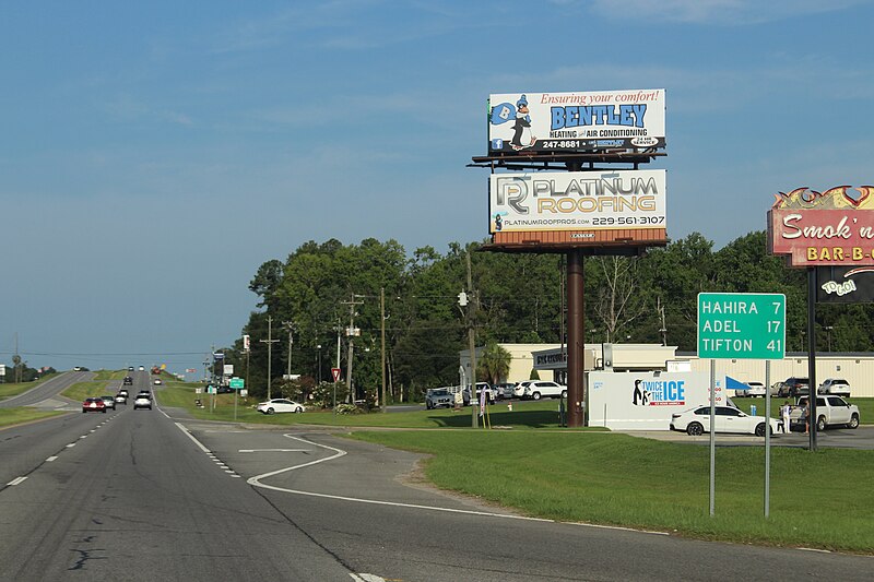 File:North Valdosta Rd, Lowndes County, Distance road sign Hahira Adel Tifton.jpg