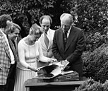 Monk and Prime Minister Pierre Trudeau (middle) showing Canada's gift to President Gerald Ford