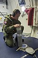 A US Navy airman prepares to deploy a Mark 58 marine location marker out of the freefall chute of a P-8A Poseidon aircraft while flying over the Indian Ocean, 15 April/Seorang askar udara Tentera Laut Amerika Syarikat bersedia untuk menghantar Mark 58 penanda lokasi keluar dari pelongsor jatuh bebas atas pesawat P-8A Poseidon semasa penerbangan di Lautan India pada 15 April/4月15日，美国海军飞行员准备在P-8A飞跃印度洋时投放Mk58海洋位置标记弹