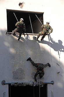 US Navy 090630-A-1839I-123 Navy of the Argentine Republic naval infantry demonstrate for the 2nd Marine Expeditionary Forces how they would enter a building through the window.jpg