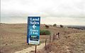 Riddells Road Ring (on far left) with sign indicating future residential development