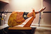 A jamón leg in a cutting stand.