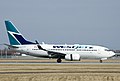 A WestJet Boeing 737-700 at Montréal–Pierre Elliott Trudeau International Airport