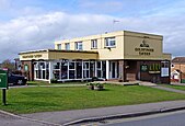 A flat-roofed pub