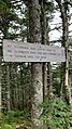 A sign on the trail up to the summit of Mt. Tecumseh.