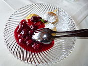 Saxon Quarkkäulchen served with hot sour cherries