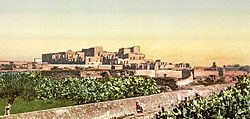 Photograph of the ruins of Mohamedia, Tunisia, including Mohamedia Palace. This color photochrome print was made in 1899 in Tunis, Tunisia.