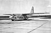 A very large high-winged glider on a concrete ramp, marked with United States Air Force insignia