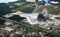 The first operational F-22A Raptor flies over Tyndall AFB on its delivery flight during 2003.