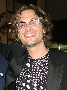 Head shot of Matthew Gray Gubler wearing glasses and smiling