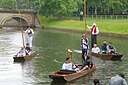 ☎∈ The Olympic torch being punted down the River Cam during the in Cambridge leg of the 2012 Summer Olympics torch relay.