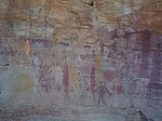 Aboriginal paintings on a rocky wall, depicting human figures