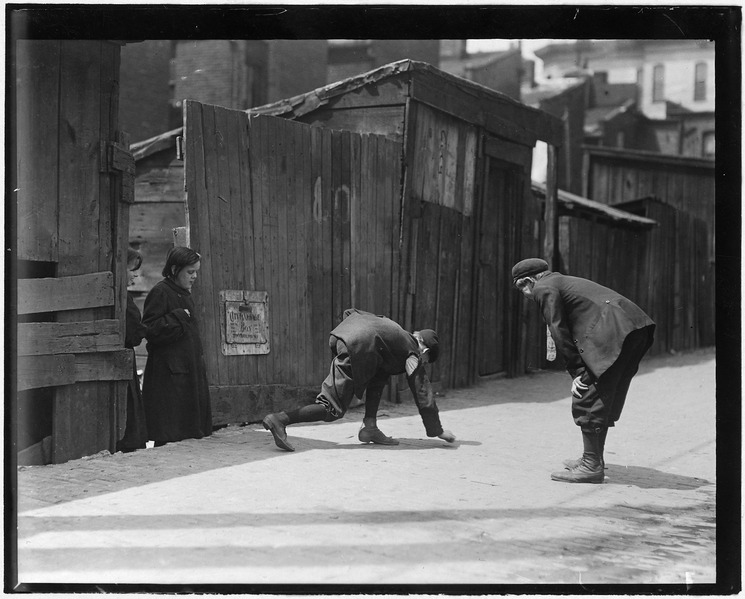 File:Truants, "Red St. Clair," and chum shooting craps in front of Murphy's Branch at 11-00 A.M. a school day. Red is boss... - NARA - 523289.tif