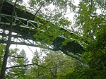 A steel bridge arching over a ravine