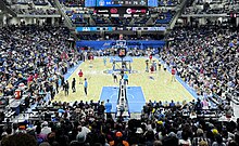 packed basketball stadium with Sky blue Paint