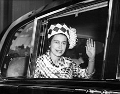 Elizabeth waving from a car