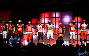 Players showing the nine possible jersey and pants combinations
