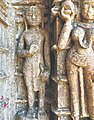 An idol of a Śvetāmbara monk draping a piece of cloth and holding a rajoharana carved on the outer walls of a Jain temple at Pavagadh Hill