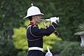 A bugler from the Band of HM Royal Marines Portsmouth (Royal Band) sounding a bugle call.