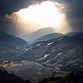 Sunset over the water filled terraces of Yuanyang county in wintertime