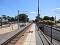 View south-east to the end of platform 1, and ramp down to pedestrian underpass.