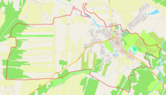 Mapa konturowa Głowaczowa, blisko centrum na prawo u góry znajduje się punkt z opisem „miejsce bitwy”