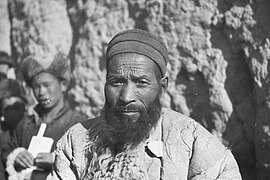 Two Dongxiang Muslims, the old one has long beard and wears sheep-skin overcoat, Tang Wang Chuan, Dongxiang County, Gansu, 1934.jpg