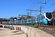 X'trapolis Mega on Kalk Bay bridge Dec 2023.jpg