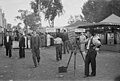 A photographer selling portrait photos in 1937.