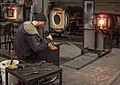 Image 97Glass blower. This was moments before he accidentally dropped it. Heartbreaking (and vasebreaking). Talented folks here, though, and I actually went back a while later and took a class. Got a piece of lit up frozen spaghetti to prove it.