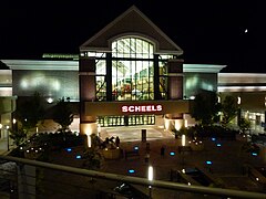 The front of Scheels All Sports at night