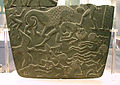 Image 6Possible prisoners and wounded men of the Buto-Maadi culture devoured by animals, while one is led by a man in long dress, probably an Egyptian official (fragment, top right corner). Battlefield Palette. (from Prehistoric Egypt)