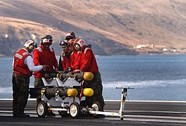 US Navy 031104-N-9769P-003 Aviation Ordnancemen inspect Hellfire missiles.jpg