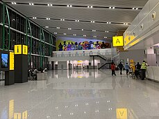 Abuja International Airport Terminal interior at night.