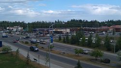 The intersection of Alumni Drive/College Road with Farmers Loop Road/University Avenue is the historic and commercial center of the College community. Photo taken June 2011 from the side of Troth Yeddha' (College Hill), upon which the University of Alaska Fairbanks campus sits.