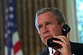 Bush speaking on the phone with Governor George Pataki and Mayor Rudolph Giuliani in a televised telephone conversation from the Oval Office on Sept. 13.