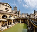 Image 15 Roman Baths Photograph credit: David Iliff The Roman Baths complex is a site of historical interest in the English city of Bath, Somerset. It is a well-preserved site dating from Roman Britain once used for public bathing. The Roman baths themselves are below the modern street level. There are four main features: the Sacred Spring, the Roman Temple, the Roman Bath House, and the museum which holds finds from the Roman town. The buildings above street level date from the 19th century. The Baths are a major tourist attraction and, together with the Grand Pump Room, received more than 1.3 million visitors in 2018. Visitors can tour the baths and museum but cannot enter the water. This picture shows the Great Bath of the Roman Baths complex, with Bath Abbey visible in the background. The entire structure above the level of the pillar bases is of later construction. More featured pictures